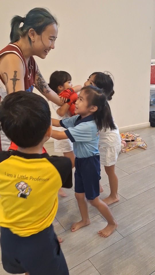 Hi! I’m Alicia and welcome to my coaching page! I'm a female Muaythai private coach and have been coaching since 2021 with 5+ years of experience in the martial art 😆
My youngest trainee started when she was only 3 years old, and my oldest trainee when he was 63! I train all genders, regardless of their age or fitness level, as I believe everyone who wishes to acquire the skills should have the opportunity to learn without fear or judgement. 
I strive to offer a safe and caring environment where my trainees can destress, and learn proper Muaythai without being intimidated by the sport 🙆♀️
Many will think Muaythai is a violent sport just because its combative, but instead it instills discipline, self-control, and perseverance in the face of adversity. 
I wish to impart life long skills to my trainees, whether it be mental strength or simply effective self-defence technique that can be applied in real life situations 🫣
I believe that learning can be made fun, whether for kids or adults, as it will further spark interest in the individual. The interest produced will promote good habits where trainees will consistently try to improve their day to day wellbeing 🥳
I coach because I have the passion to pass on the knowledge I have to those who are willing to learn. I LOVE teaching beginners because I know how hard it is to make the decision to take the first step as I too was afraid before ❤️
Join me today to kickstart your journey! I promise I won't bite 😁