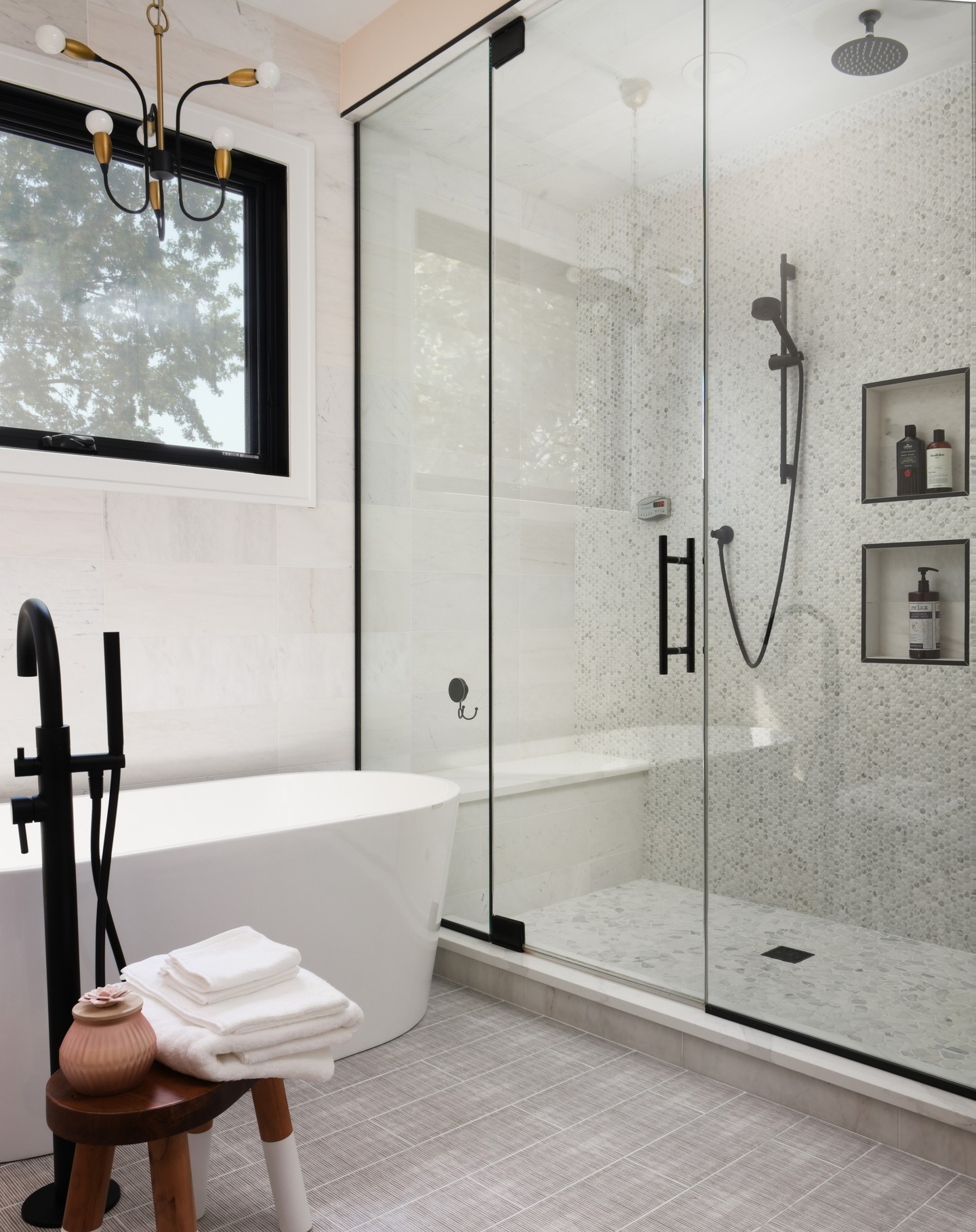 Rain head vs handheld: do you really need both?
Absolutely! Especially if your shower doubles as a spa, pet wash, kid station, and post-tennis recovery zone.
In this new construction primary bath, we paired a ceiling-mounted rain head with a sleek handheld for full flexibility—because nothing says luxury like not having to choose. The overhead fixture gives that relaxing, immersive feel while the handheld handles everything else (even rinsing the bench).
The rest? Subtle marble textures and patterns, the lightest terracotta paint color that gives this bathroom a golden-hour glow at all times, and black and gold accents for that layered modern feel.
Design by @adinahalldesign
Photography by @angelikapiatek
#adinahalldesign #chicagointeriordesigner #primarybathroomdesign #newconstructionhome #modernbathroom #rainshower #bathroominspo #bathroomtrends2025 #luxurybathroom #freestandingtub #showergoals #interiordesignchicago #custombathroom #bathroomdetails #moderninteriors #chicagodesigner #bathroomstyling #blackandgold #interiordesigninspo #interiorarchitecture #interiordetails #spaathome #architectureanddesign #bathroomgoals