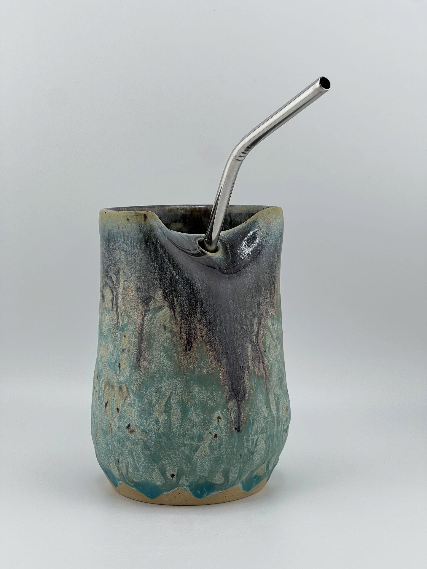 This Cold Cup with Straw is made with Roo clay. The glazes are many! First it’s covered in Riptide, then Dark Flux is on the rim and straw plane. Then Glacier on top of the Dark Flux. Lots of melty goodness here.