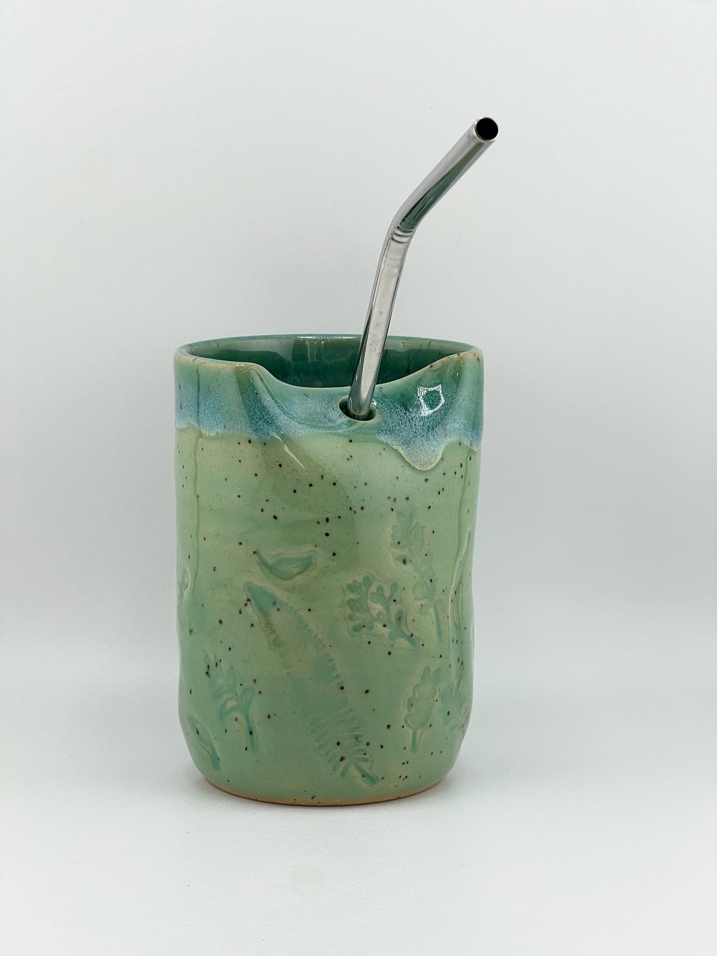 Cold Cup with floral impressions. Glaze is Succulent Celadon on full body with Gun Metal Green on rim. Clay is Roo.